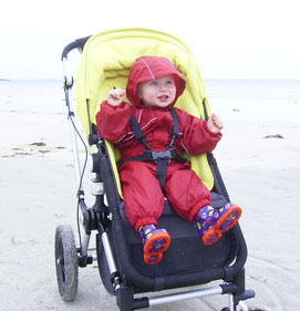 Ethan snug on a chilly beach in Regatta Puddle Suit