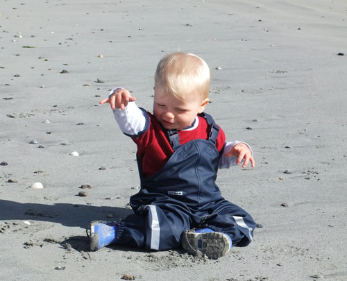 Harvey on the beach in his Ocean Dungarees