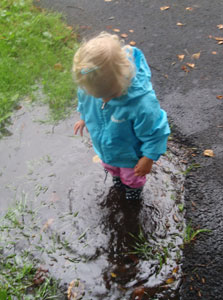 Puddle Jumping in Playshoes Navy Dots wellies