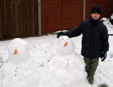 Max proudle showing off the snowmen