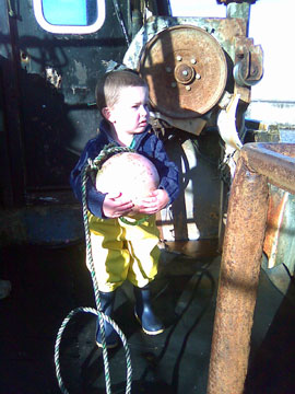 Dylan John - a little boy with a buoy