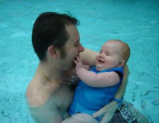 Jack and Dad enjoying a cuddle in the water