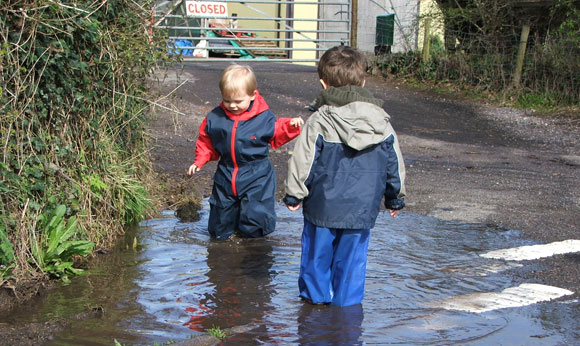 Magnus and Toby enjoying a giant puddle!