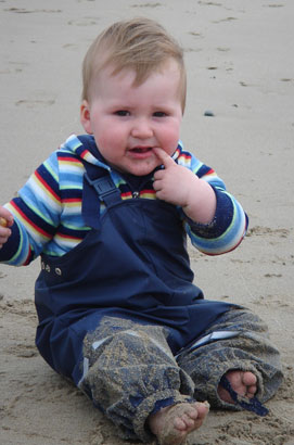 Max F in Kiba dungarees on the beach