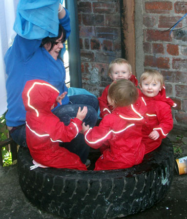 The Task Childcare kids in Puddle Suits