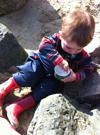 Thomas B enjoying ice cream in Togz Watrm and Dry dungarees