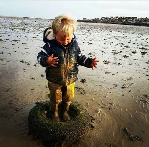 Vinnie age 2, loves his waders, loves mud!